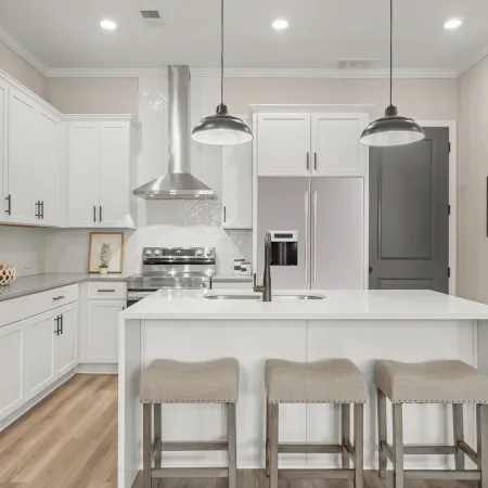 a kitchen with white cabinets