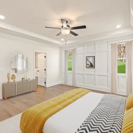 a room with a bed and a fan