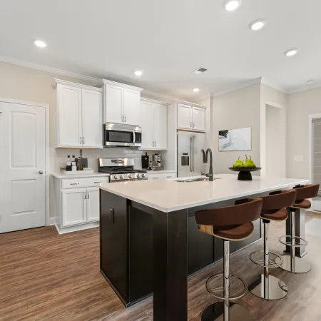 a kitchen with white cabinets