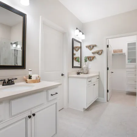 a kitchen with a sink and a mirror