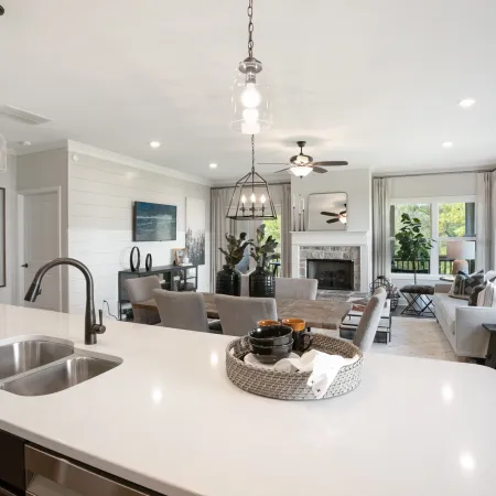 a kitchen with a sink and a mirror