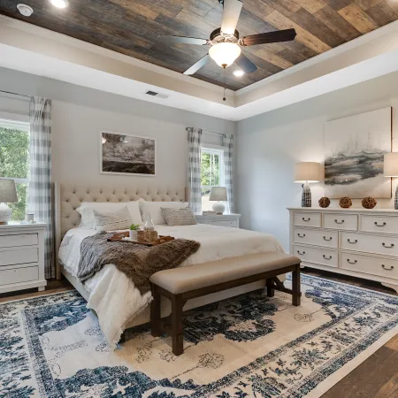 a living room filled with furniture and a large window