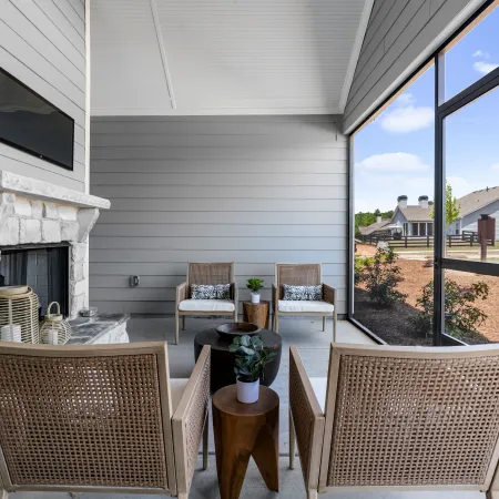 a patio with a table and chairs