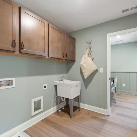 a bathroom with a sink and cabinets