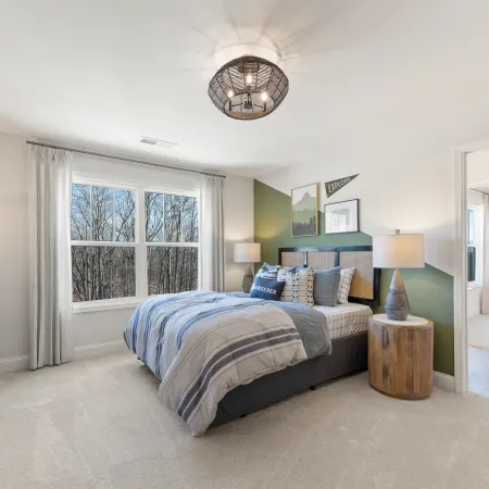 a bedroom with a large window