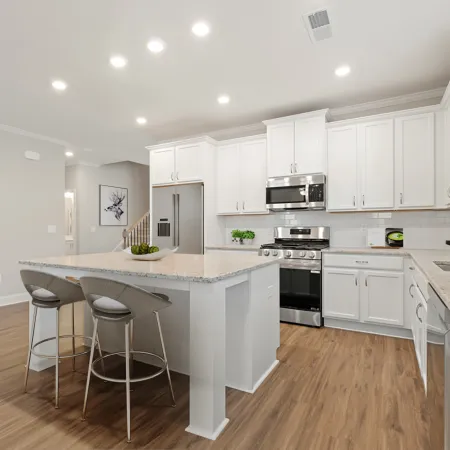 a kitchen with white cabinets