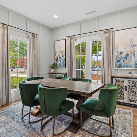 a dining room with a table and chairs
