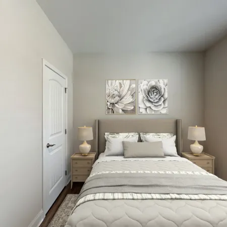 a bedroom with a bed and lamps