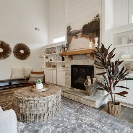 a living room filled with furniture and a fireplace