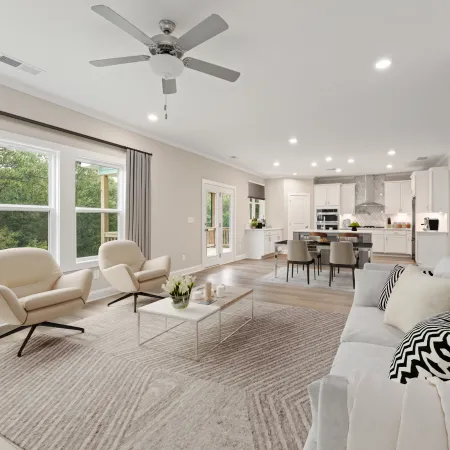 a living room with a large white couch and a table
