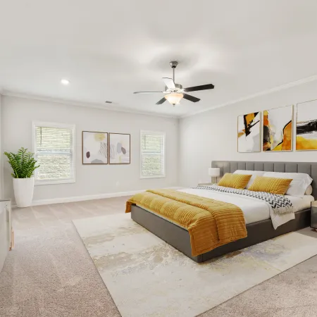 a bedroom with a bed and a fan