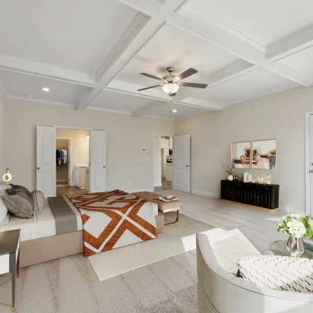 a large living room with a bed and a couch
