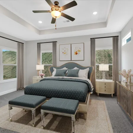 Modern bedroom with blue upholstered bed, matching benches, beige curtains, nightstands, and ceiling fan.