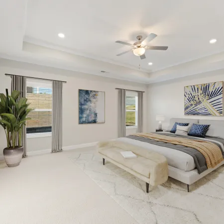 a bedroom with a bed and a couch