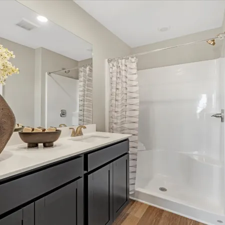 a bathroom with a tub and sink
