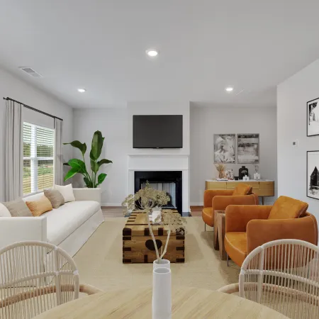Modern living room with white sofa, brown armchairs, wooden coffee table, fireplace, and black and white wall art.