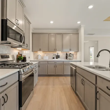 a kitchen with white cabinets