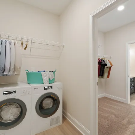 a laundry room with a washing machine