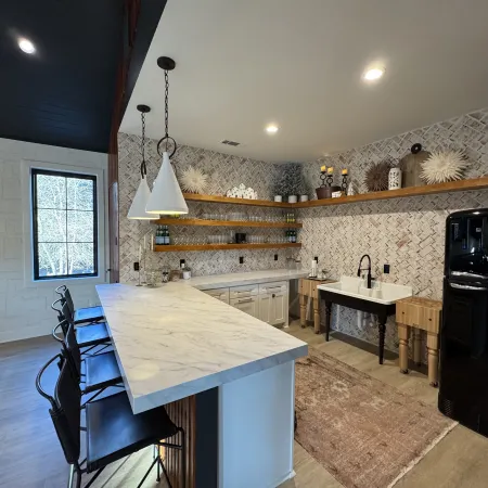 a kitchen with a bar and a table