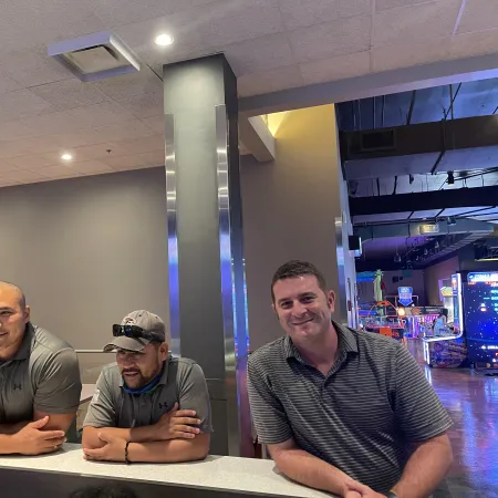 a group of men sitting at a table