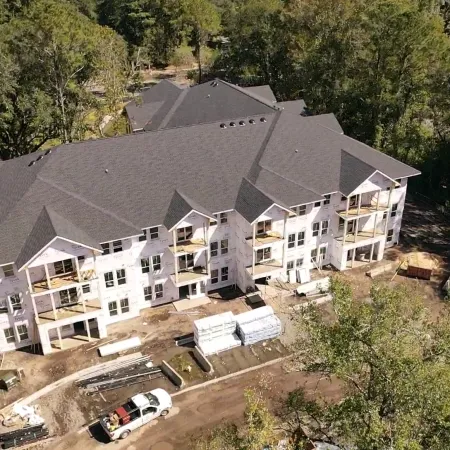 a large house with trees around it