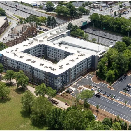 a large building with a parking lot