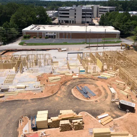 a construction site with a building in the background