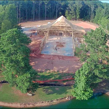 a large dam surrounded by trees