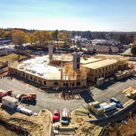 a large building with a parking lot