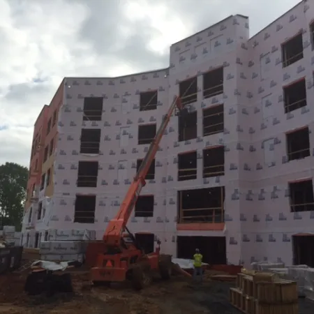 a crane next to a building