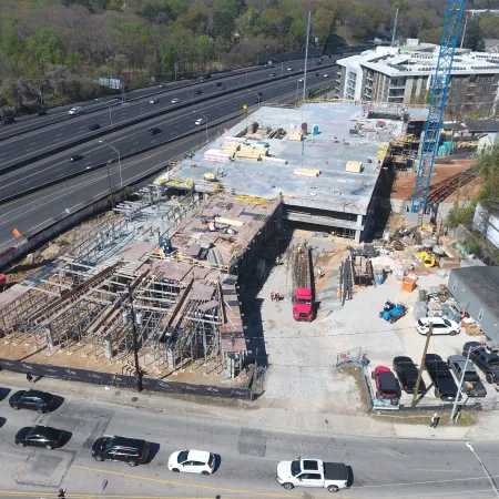 a construction site with cars and trucks