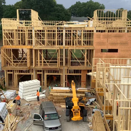 a car parked in front of a building under construction