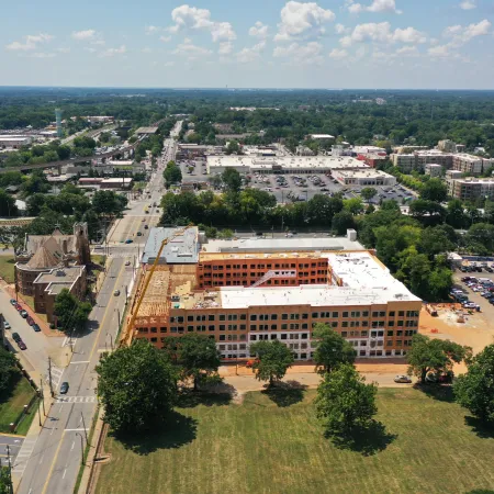 a large building with a parking lot