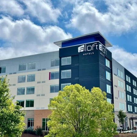 a large building with trees in front of it