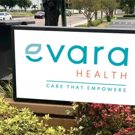 Evara Health sign with slogan Care That Empowers outside a medical office at address 707.