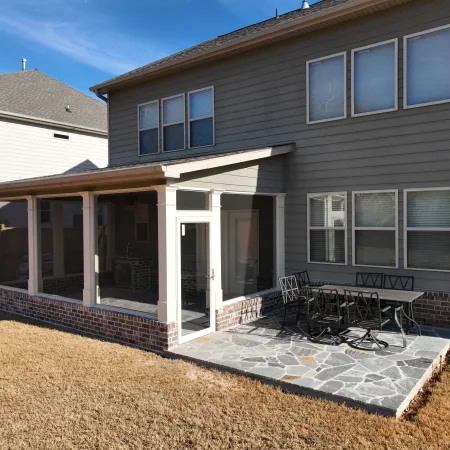 a house with a patio and a brick patio