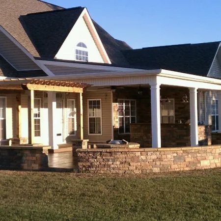 a house with a stone wall