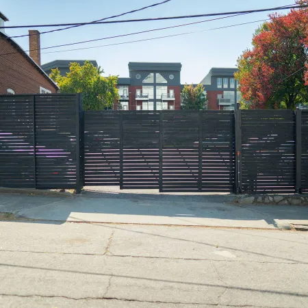 a black fence with a black gate