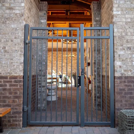 a gate in a brick building