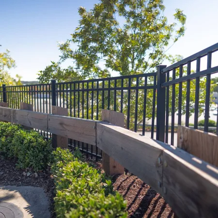 a metal fence with a railing