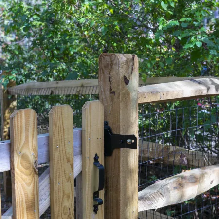 a wooden fence with a bird house