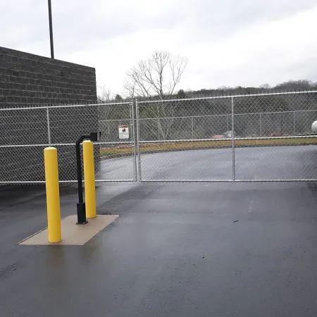 a parking lot with a fence