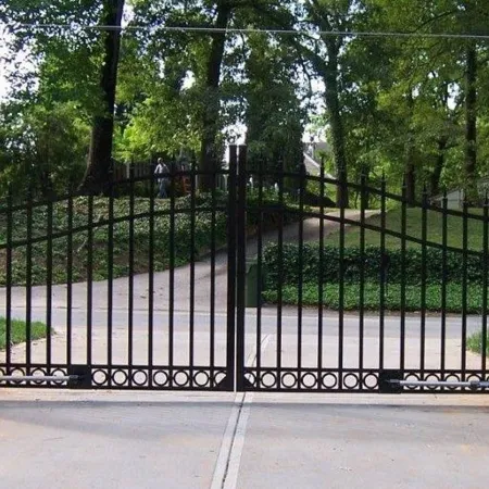 a gate with trees in the background