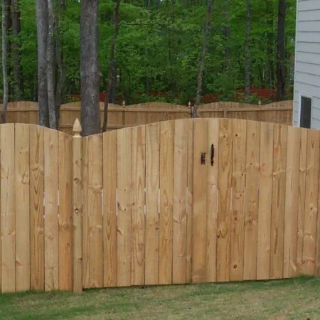 a wooden fence in front of a house