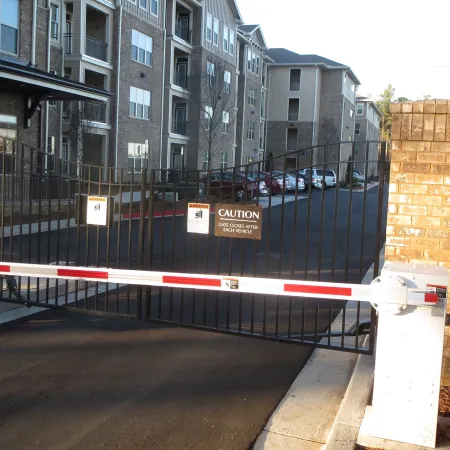 a black gate with a red railing