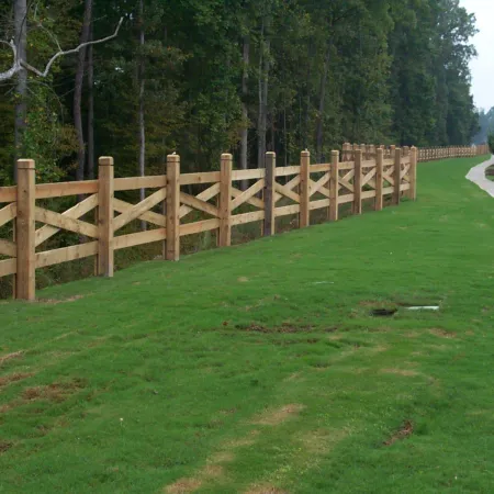 a wooden fence in a park