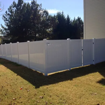 a white fence in a yard