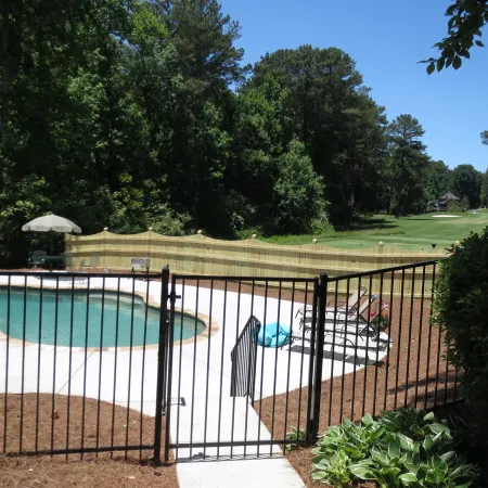 a swimming pool with a fence around it