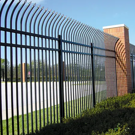 a gated off area with a brick wall and a brick building