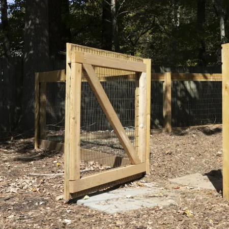 a wooden structure in a wooded area